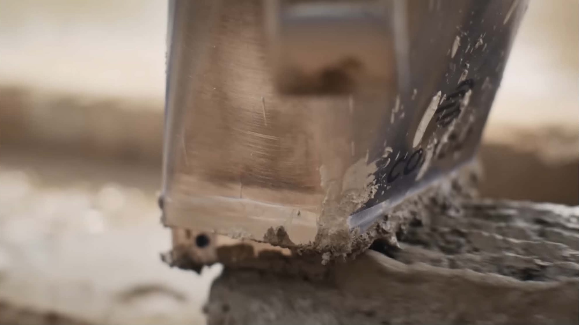 Detailed view of freshly printed concrete layers showing the precision of 3D construction printing